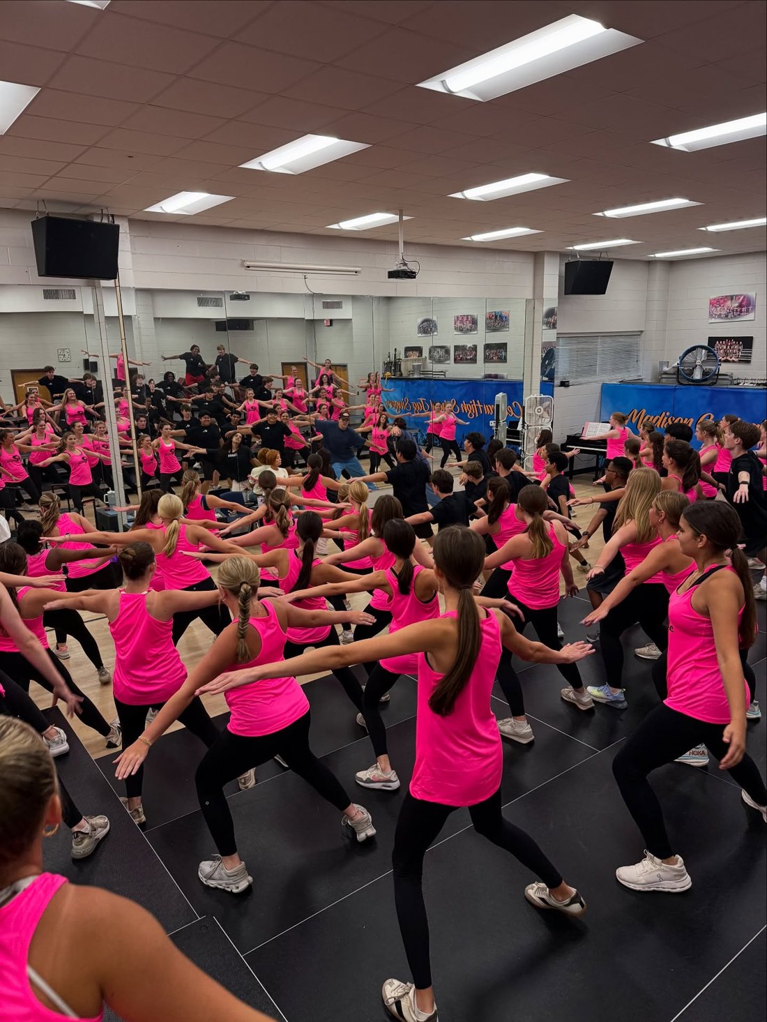 Jag Singers full ensemble rehearsing dance choreography